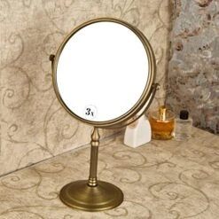 Leyden Antique Brass Makeup Mirror, 3X Magnifying Vanity Mirror Tabletop Double Side 7.8 Inch Bathroom Hardware Accessories -Safavieh Furniture 51swVoLTGzL